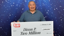 Dixon Prince holding big cheque