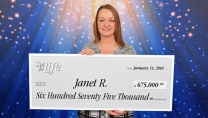 Janet R. Holding big cheque